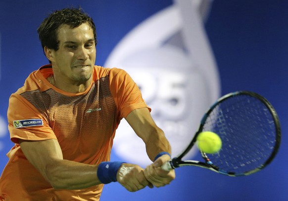 Evgeny Donskoy of Russia returns the ball to Roger Federer of Switzerland during the Dubai Tennis Championships, in Dubai, United Arab Emirates, Wednesday, March 1, 2017. (AP Photo/Kamran Jebreili)