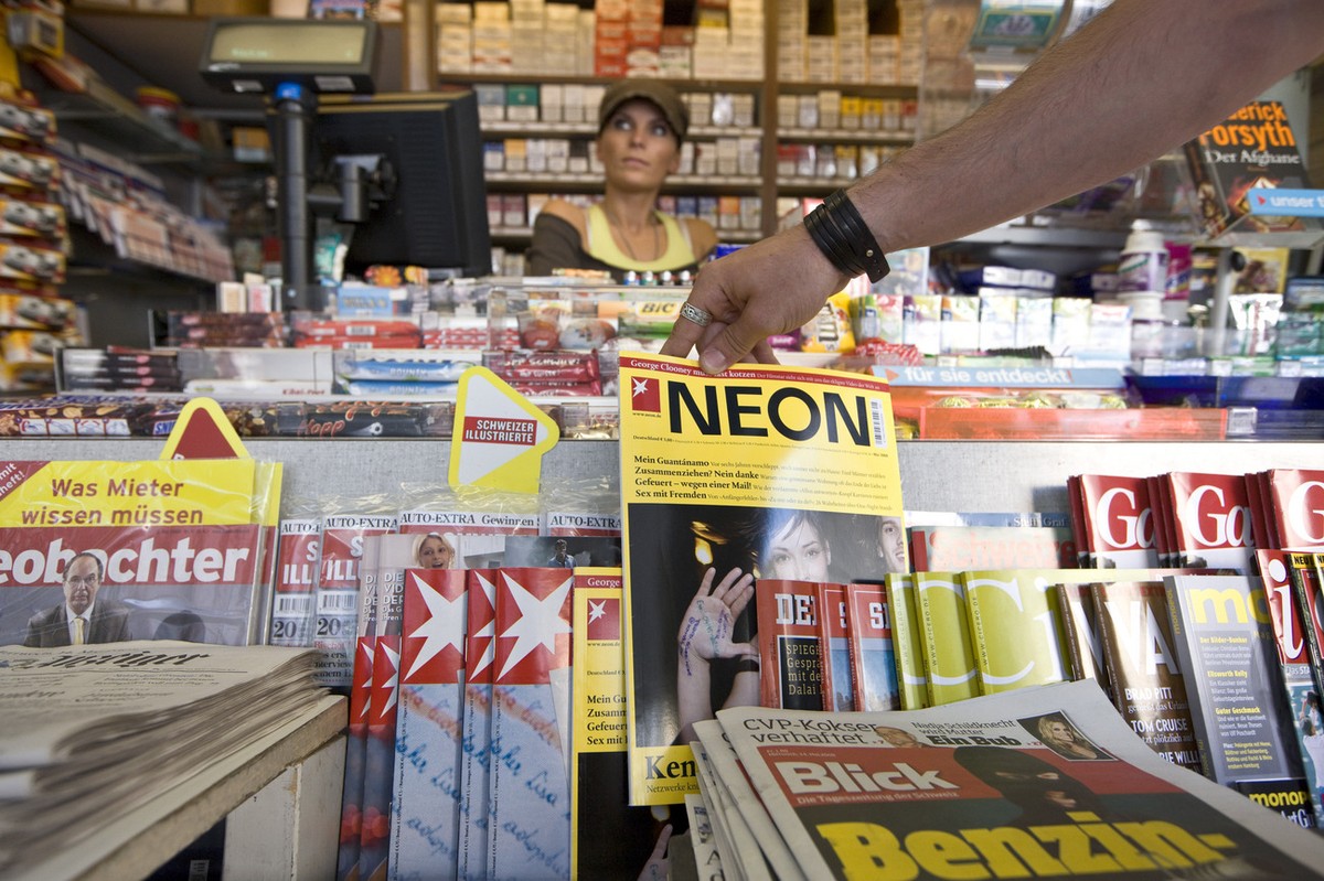 A customer reaches for the magazine "NEON" at display at a kiosk in Zurich, Switzerland, pictured on May 14, 2008. With over 1000 stores, the k kiosk-chain runs the majority of kiosks in Swi ...
