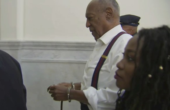 In this frame from video, Bill Cosby, center, leaves the courtroom after he was sentenced to a three-to 10-year sentence for felony sexual assault on Tuesday, Sept. 25, 2018, in Norristown, Pa. (Pool  ...
