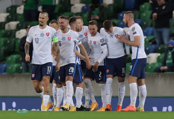 epa08816502 Slovakia's players celebrate after Juraj Kucka scores the 0-1 goal during the UEFA EURO 2020 play-off soccer match between Northern Ireland and Slovakia at Windsor Park stadium in Bel ...