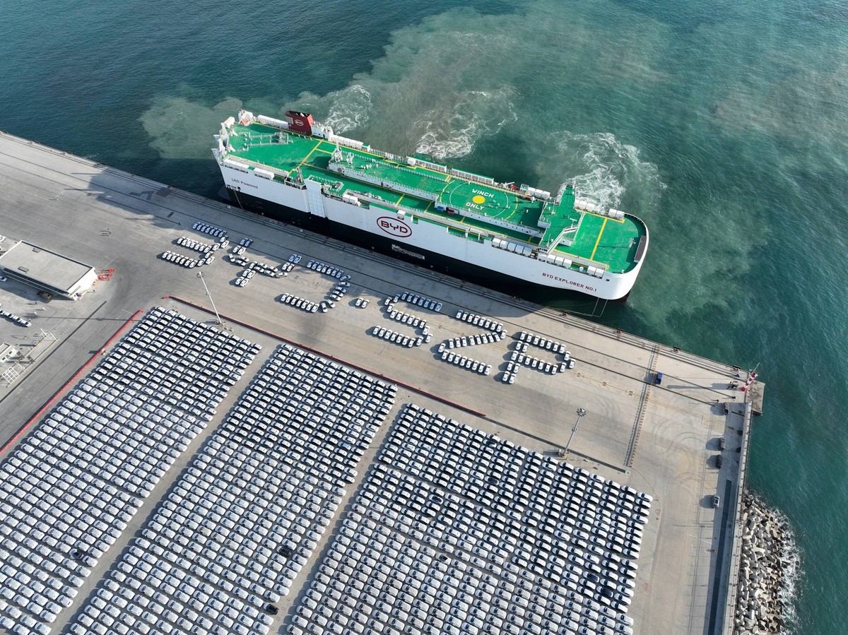 240116 -- SHENZHEN, Jan. 16, 2024 -- Vehicle carrier vessel BYD EXPLORER NO.1 arrives at Xiaomo International Logistics Port in Shenzhen, south China s Guangdong Province, Jan. 14, 2024. BYD EXPLORER  ...