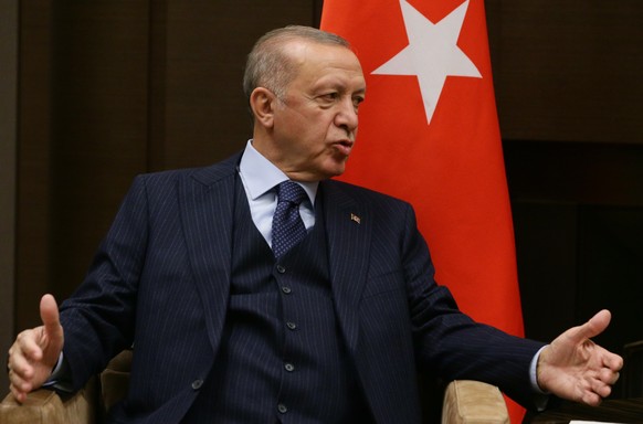 epa09495225 Turkish President Recep Tayyip Erdogan gestures as he speaks to Russian President Vladimir Putin (not pictured) during their meeting at the Bocharov Ruchei residence in Sochi, Russia, 28 S ...