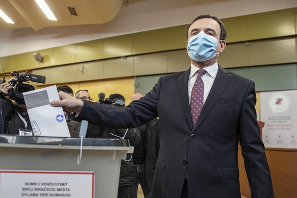 Albin Kurti, a candidate for prime minister of Vetevendosje (Self-Determination), casts his ballot paper in parliamentary elections in capital Pristina, Kosovo, Sunday, Feb. 14, 2021. Kosovo is holdin ...