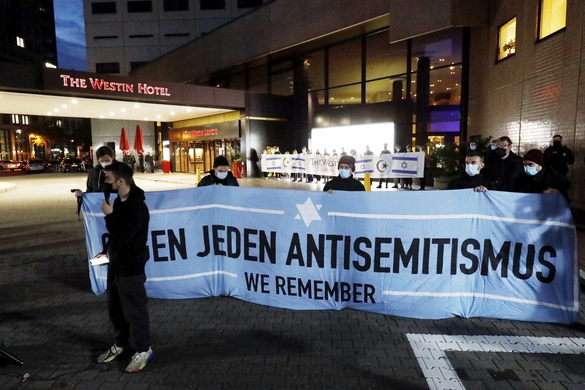 People gather in front of the "Westin Hotel" in Leipzig, Germany, Tuesday, Oct. 5, 2021 to show solidarity with the musician Gil Ofarim. A leading Jewish group in Germany says it's shoc ...