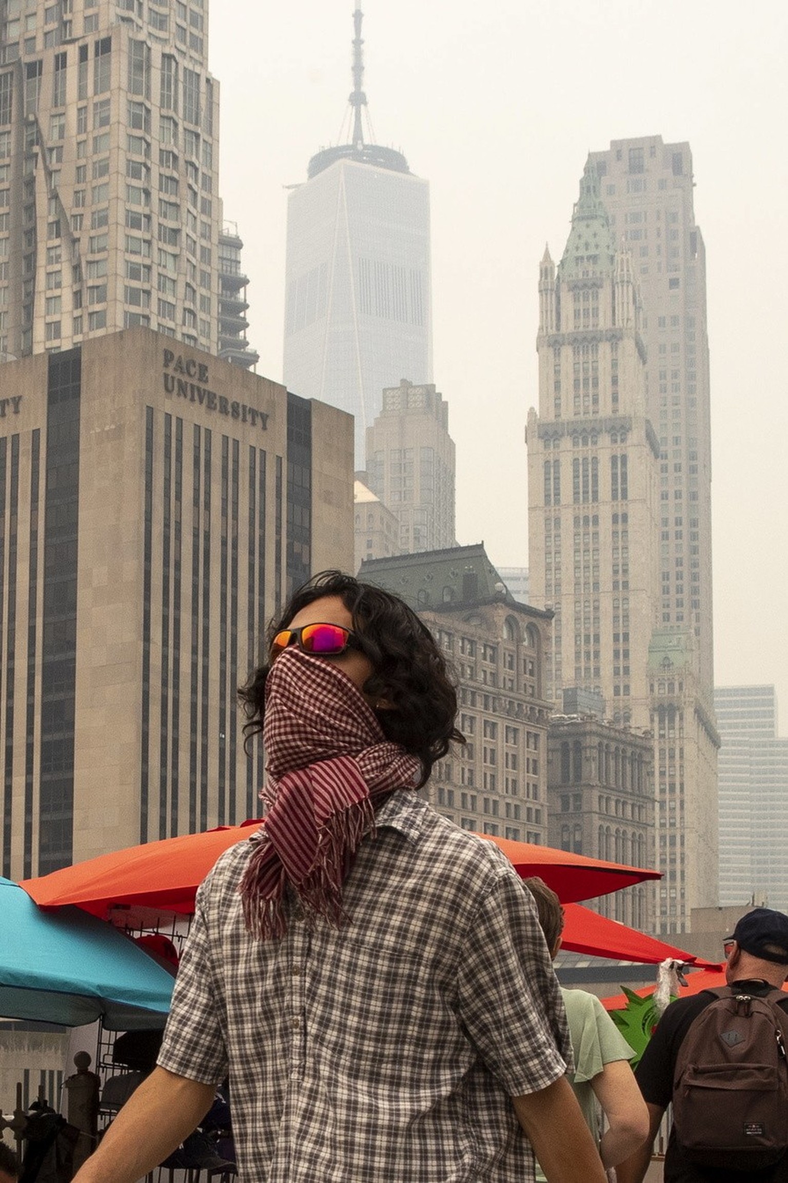 epa10678141 A person wears a scarf over the face due to smoke in the air as a result from Canadian wildfires engulfing the New York area, making it the worst air quality in the world at the moment, on ...