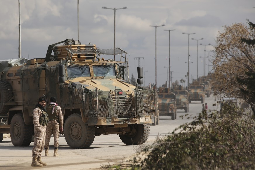 Turkish military convoy drives in Idlib province, Syria, Saturday, Feb. 22, 2020. A Turkish soldier was killed in Syria&#039;s northwest Idlib province, state-run Anadolu news agency reported Saturday ...