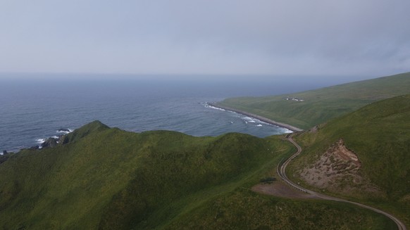 This aerial photograph taken July 7, 2021, shows picturesque hiking spot, Horseshoe Bay, and the decaying LORAN station, a Cold War-era navigation facility, on Adak Island, Alaska. (Nicole Evatt via A ...