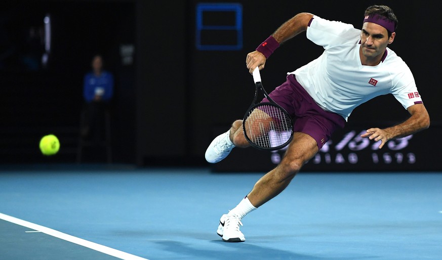 epa08166107 Roger Federer of Switzerland in action during his fourth round match against Marton Fucsovics of Hungary on day seven of the Australian Open tennis tournament at Melbourne Park in Melbourn ...