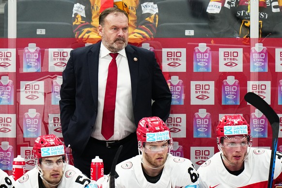 Denmark&#039;s head coach Heinz Ehlers watches the group A match between Denmark and Germany at the ice hockey world championship in Tampere, Finland, Thursday, May 18, 2023. (AP Photo/Pavel Golovkin)