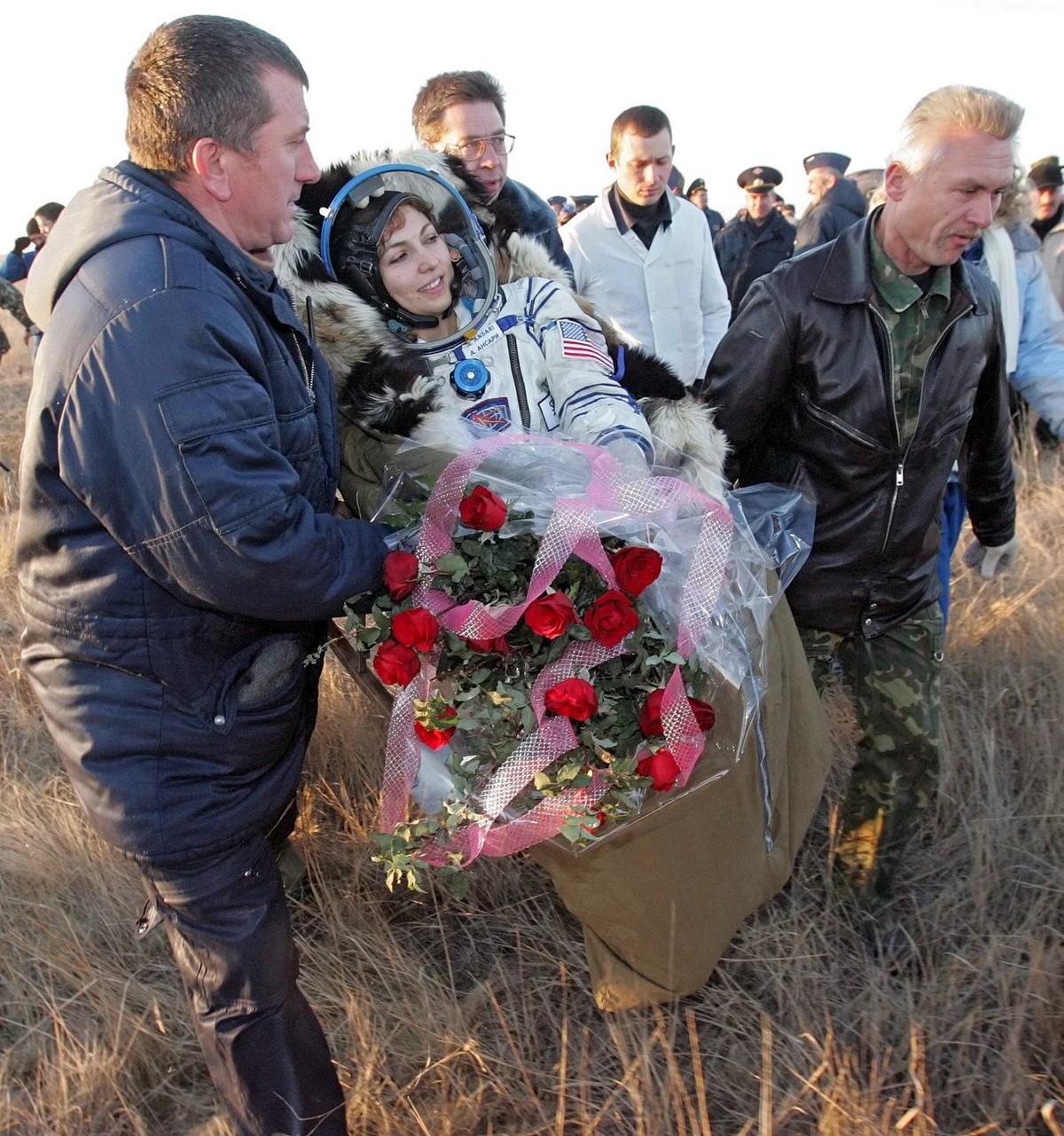 Russian search and recover specialists carry U.S. entrepreneur and the world's first female space tourist Anousheh Ansari shortly after landing of Russian Souyz space capsule not far from Kazakh  ...