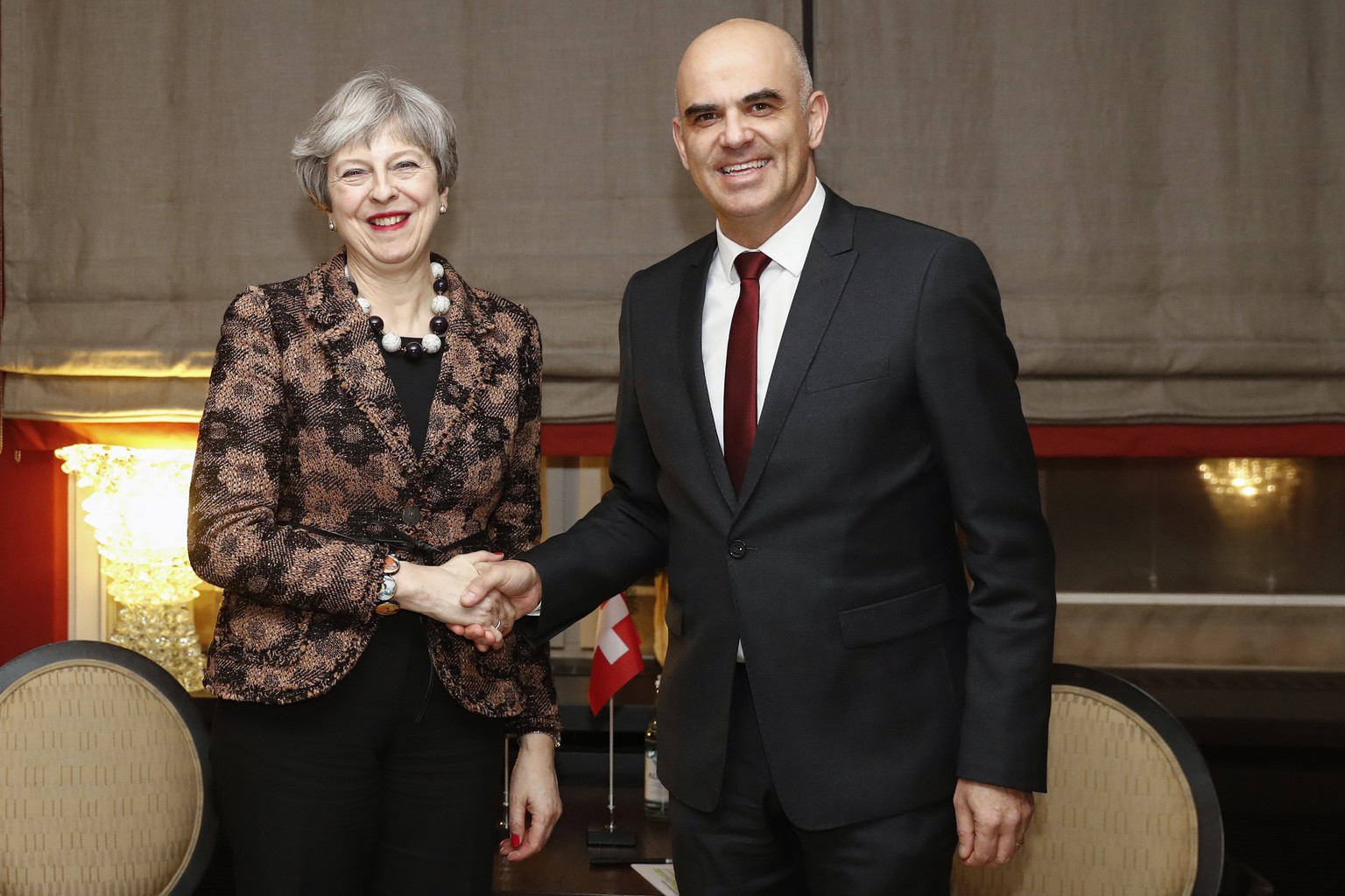 Swiss Federal President Alain Berset, right, and Britain&#039;s Prime Minister Theresa May, left, shake hands during a bilateral meeting during the 48th Annual Meeting of the World Economic Forum, WEF ...