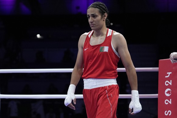 Algeria&#039;s Imane Khelif walks in the ring after fighting Italy&#039;s Angela Carini in their women&#039;s 66kg preliminary boxing match at the 2024 Summer Olympics, Thursday, Aug. 1, 2024, in Pari ...