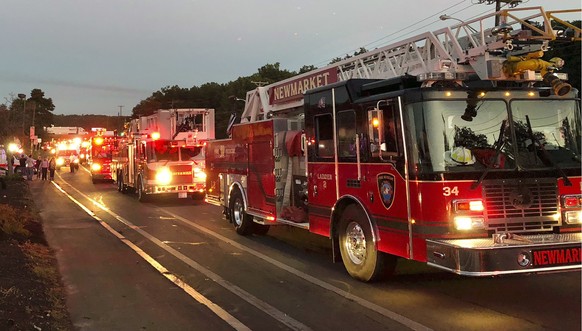 Multiple fire trucks from surrounding communities arrive Thursday, Sept. 13, 2018, in Lawrence, Mass., responding to a series of gas explosions and fires triggered by a problem with a gas line that fe ...