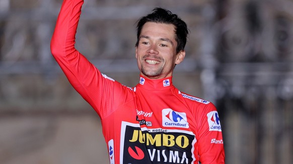 epa09450202 Slovenian rider and overall leader Primoz Roglic of Jumbo Visma team celebrates after winning the Spanish Cycling Vuelta, following the last stage, a 33,8km-long individual time-trial race ...