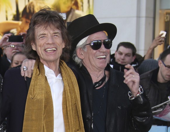 FILE - In this April 4, 2016 file photo, Mick Jagger, left, and Keith Richards pose for photographers upon arrival at the Rolling Stones Exhibitionism preview in London. Richards says he regrets sayin ...
