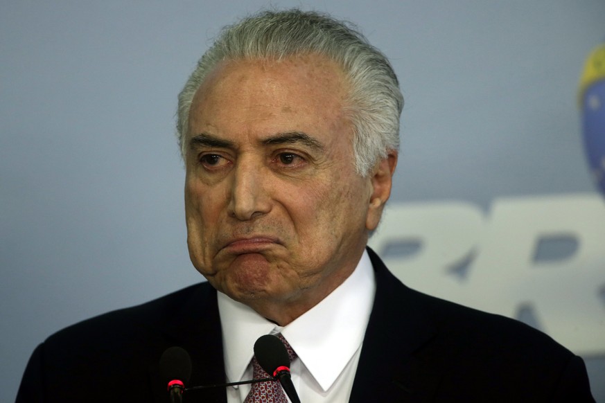 epa06053259 Brazilian President Michel Temer speaks during a press conference at the Presidential Palace in Planalto in Brasilia, Brazil, 27 June 2017. President Michel Temer was formally charged with ...