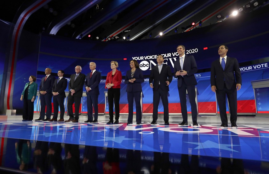 From left, Democratic presidential candidates Sen. Amy Klobuchar, D-Minn., Sen. Cory Booker, D-N.J., South Bend Mayor Pete Buttigieg, Sen. Bernie Sanders, I-Vt., former Vice President Joe Biden, Sen.  ...