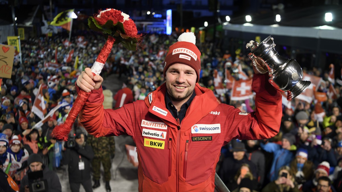 The winner Beat Feuz of Switzerland, celebrates during the prize giving ceremony after the men's downhill race at the Alpine Skiing FIS Ski World Cup in Wengen, Switzerland, Saturday, January 18, ...
