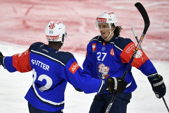 ZurichÕs Roman Wick, right, celebrates after his second goal for Zurich with, Dave Sutter, left, during the Champions Hockey League match between Switzerlands ZSC Lions and British Nottingham Panthers ...