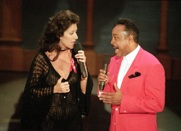FILE - Celine Dion, left, and Peabo Bryson perform the song "Beauty and the Beast," that won them the Grammy for Best Pop Vocal Performance by a Group or Duo, at the 35th annual Grammy Award ...