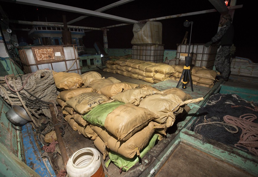 epa06417629 An undated handout photo made available by the Royal Australian Navy (RAN) on 05 January 2018 shows parcels of seized narcotics on the deck of a smuggling vessel in the Arabian Sea. HMAS W ...