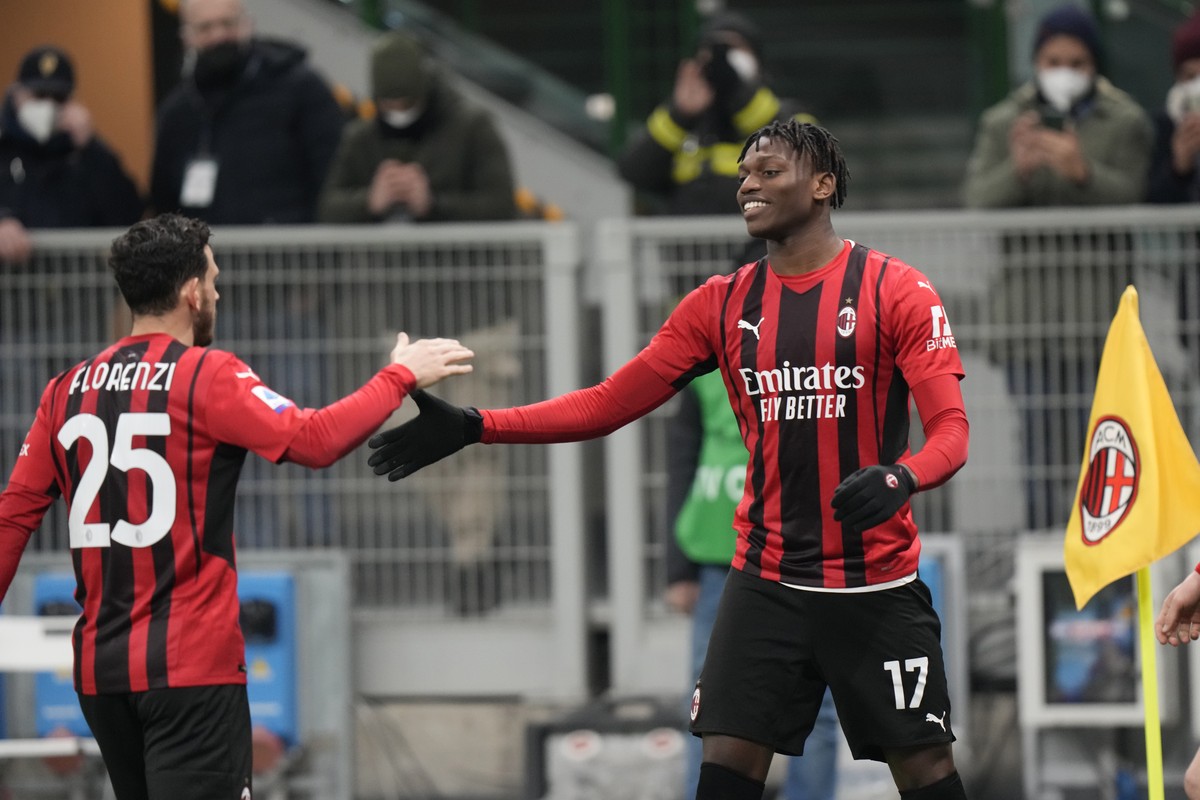 AC Milan's Rafael Leao, right, celebrates his goal with his teammate Alessandro Florenzi during a Serie A soccer match between AC Milan and Spezia, at the San Siro stadium in Milan, Italy, Monday ...