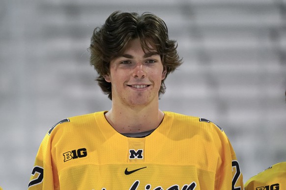 University of Michigan defenseman Owen Power smiles during an NCAA college hockey practice in Ann Arbor, Mich., Wednesday, Sept. 22, 2021. Owen Power passed on a chance to make millions this season wi ...