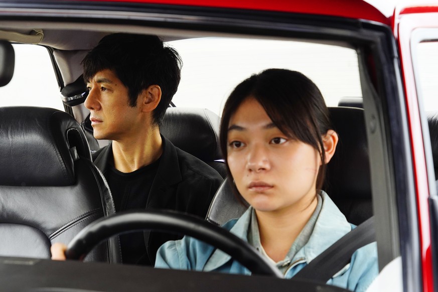 This image released by Janus Films and Sideshow shows Hidetoshi Nishijima, left, and Toko Miura in a scene from &quot;Drive My Car.&quot; (Janus Films and Sideshow via AP)