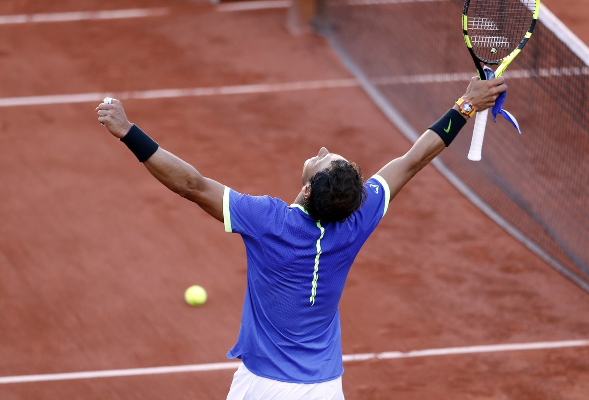 Spain's Rafael Nadal celebrates winning against Austria's Dominic Thiem during their semifinal match of the French Open tennis tournament at the Roland Garros stadium, in Paris, France, Frid ...