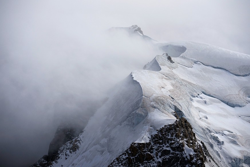 The Mont-Blanc massif mountains are seen from the Aiguille du Midi in Chamonix, France, Saturday, Sept. 5, 2026. (AP Photo/Laurent Cipriani)
France Mont Blanc Climate Change