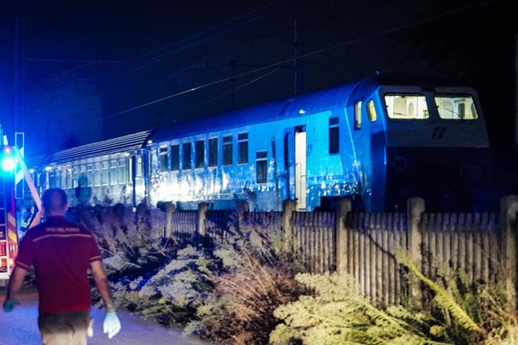epa10830118 Firefighters arrive at the railway station near which a regional train hit seven workers who were working on the tracks in Brandizzo, Turin, Italy, 31 August 2023. Five of the workers were ...