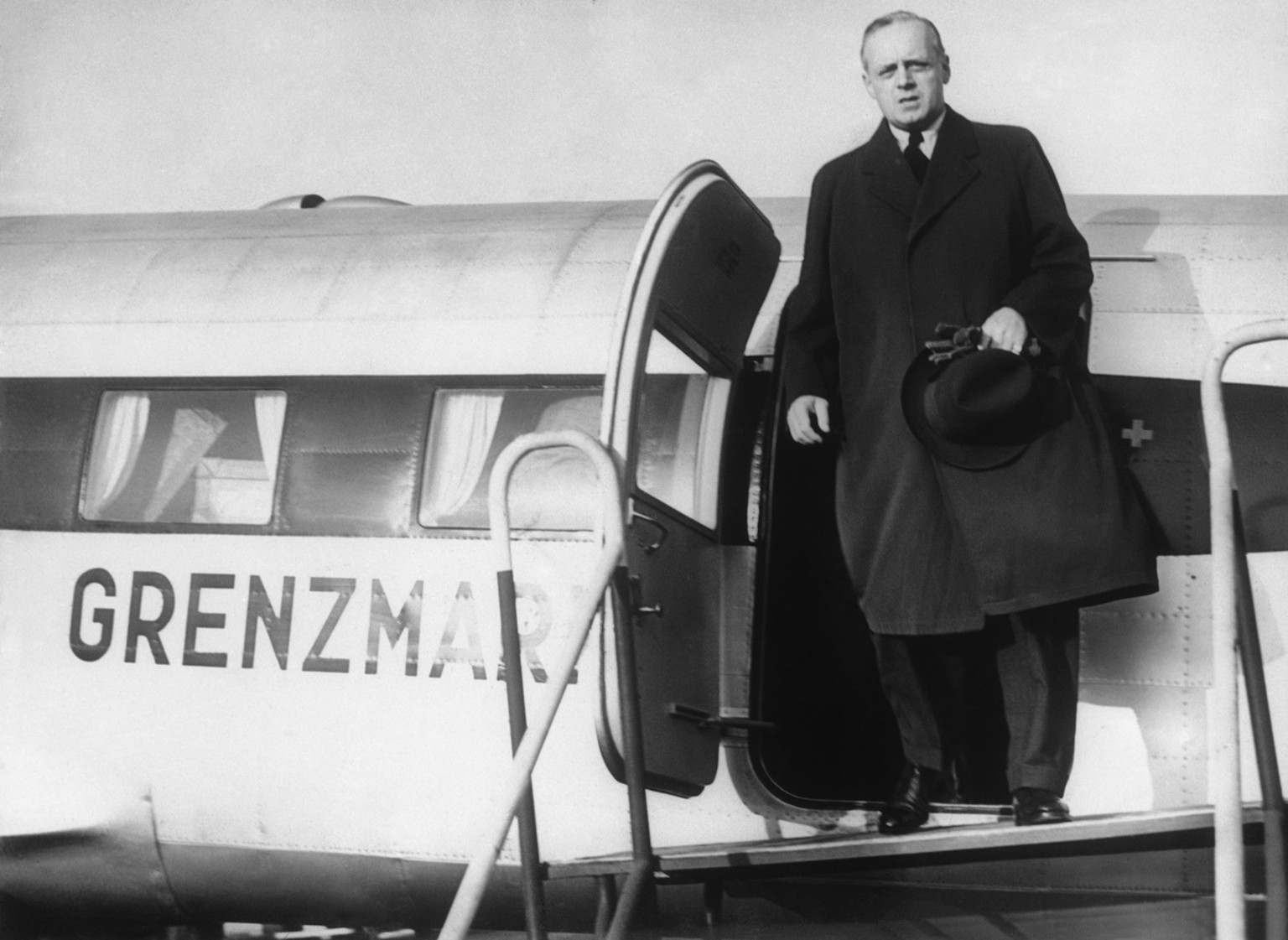 Joachim von Ribbentrop, German Foreign Minister who is flying from Salzburg to Moscow to sign a non-aggression pact with Russia, halted at the Tempelhof Airport in Berlin to receive the latest news co ...