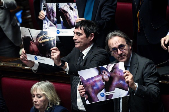 epa11876802 Secretary of Italian Left (Sinistra Italiana) party Nicola Fratoianni (L), and co-spokesperson of Green Europe (Europa Verde) party Angelo Bonelli (R) hold photos depicting tortured people ...