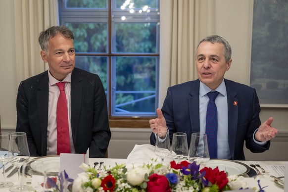 epa12942518 Swiss Ambassador Alain Gaschen (L), Federal Council Delegate for the G7, listens as Swiss Foreign Minister Ignazio Cassis (R) speaks during a bilateral meeting between Switzerland and Fran ...
