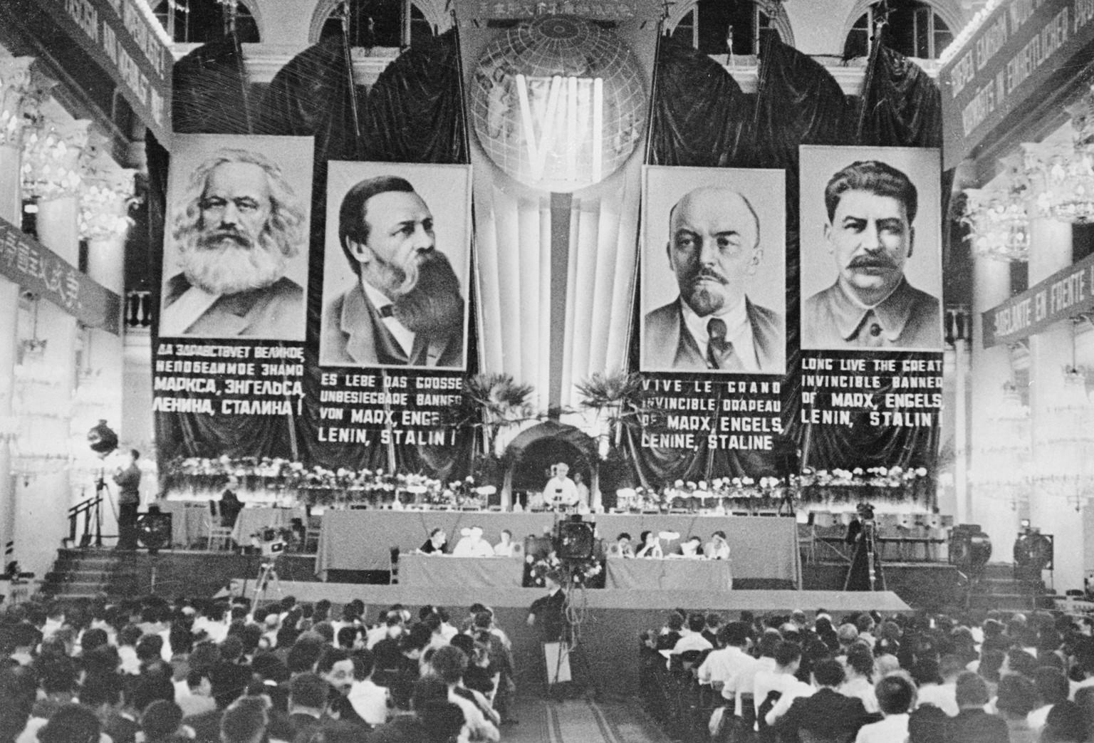 Communists gather for an important meeting in the House of Trade Unions in Moscow, with multilingual proclamations and banners of &quot;fathers&quot; of the Marxist state, during the Stalin era. The H ...