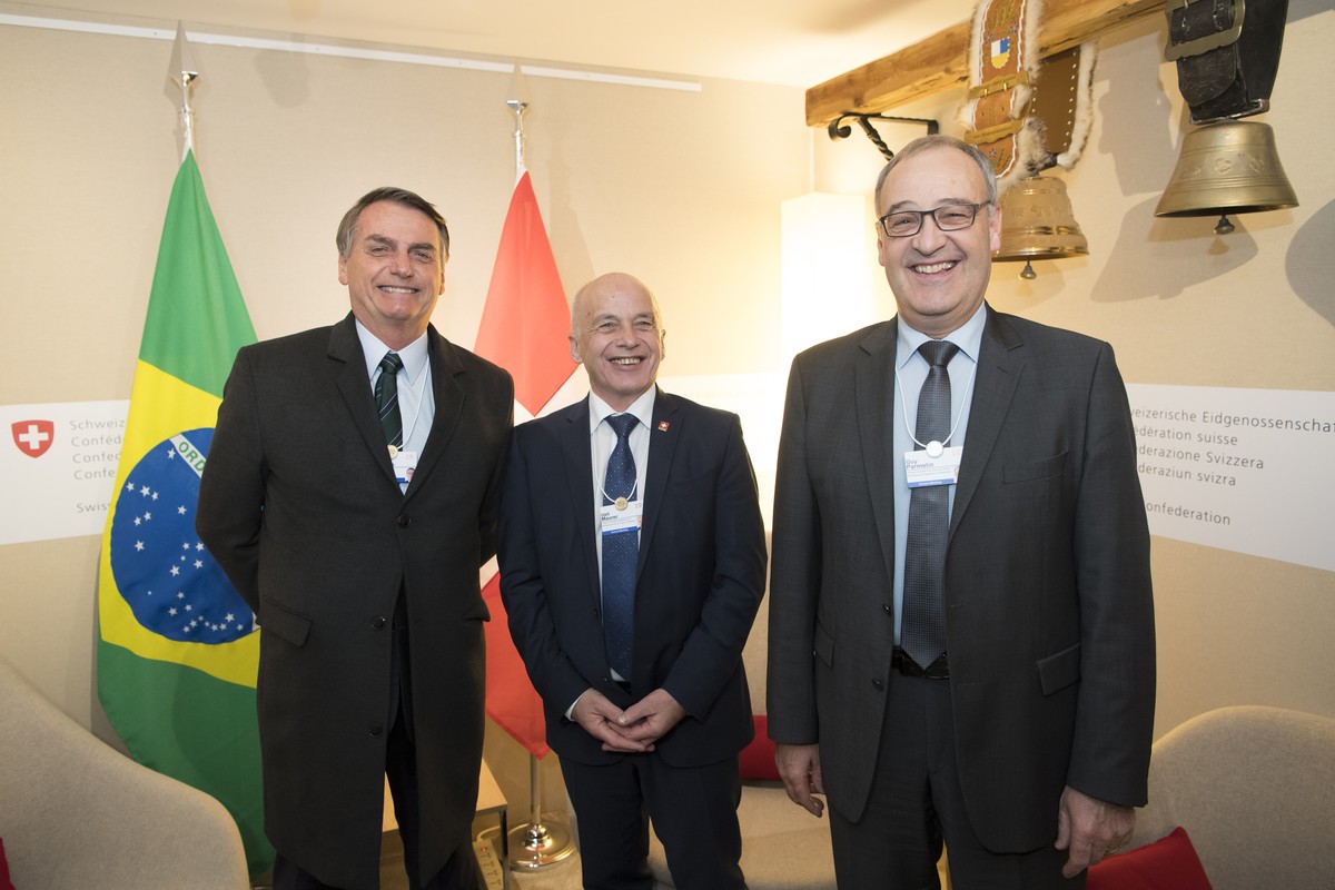 From left, Brazil's President Jair Bolsonaro, Swiss Federal President Ueli Maurer and Swiss Federal Councillor Guy Parmelin pose during a bilateral meeting on the sideline of the 49th Annual Meet ...