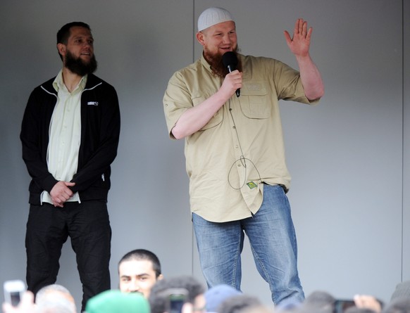 epa04235450 Controversial Salafist preachers Sven Lau (L) and Pierre Vogel (R) speak in front of the train station in Bremen, Germany, 01 June 2014. Bremen city council banned the event, but they were ...