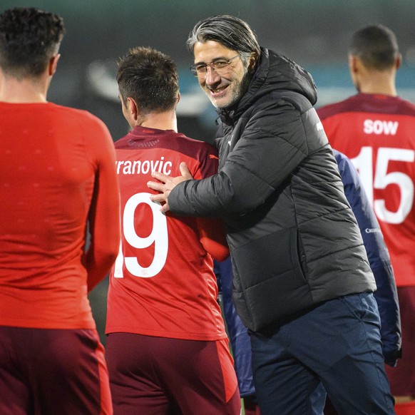 Switzerland&#039;s head coach Murat Yakin congratulates his players after the 2022 FIFA World Cup European Qualifying Group C soccer match between Lithuania and Switzerland at LFF stadium in Vilnius,  ...