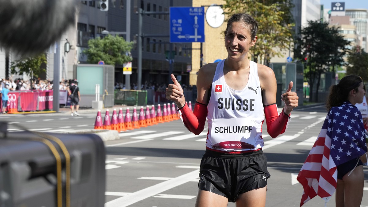 epa09402221 Fabienne Schlumpf of Switzerland reacts after finishing twelfth in the the Women's Marathon during the Athletics events of the Tokyo 2020 Olympic Games at the Odori Park in Sapporo, J ...