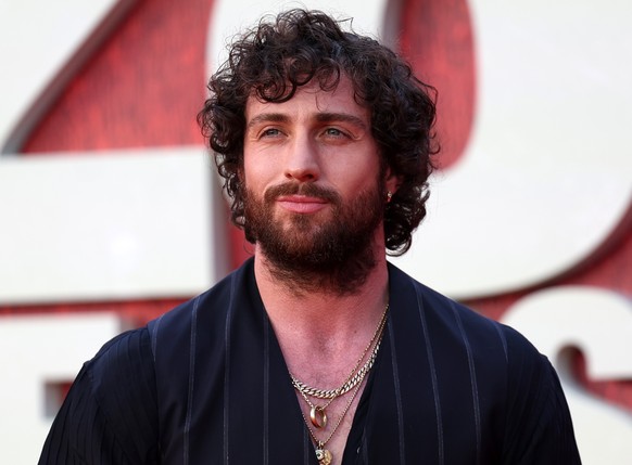 epa12184170 British actor and cast member Aaron Taylor-Johnson poses on the red carpet at the world premiere of '28 Years Later' at the Odeon Luxe Leicester Square in London, Britain, 18 Jun ...