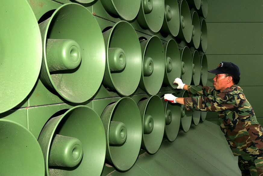 epa06686340 (FILE) - A South Korean soldier removes loud speakers in the Demilitarized Zone (DMZ) in Paju, north of Seoul, South Korea, 16 June 2004 (reissued 23 April 2018). According to media report ...