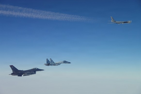 This photo provided by the U.S. Department of Defense shows a North American Aerospace Defense Command F-16 fighter aircraft intercepting Russian Tu-95 and Su-35 military aircraft near the Bering Stra ...