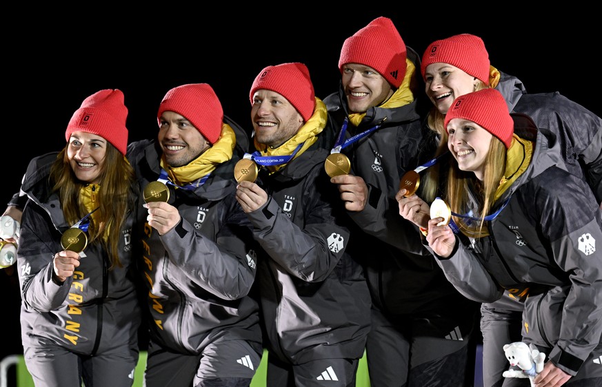 epa12732343 Gold medalists Team Germany pose with their medals during the medal ceremony for the Team Relay of the Luge competitions at the Milano Cortina 2026 Winter Olympic Games, in Cortina d' ...