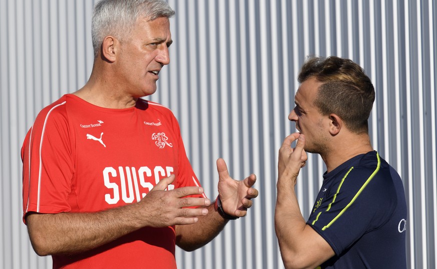 Switzerland&#039;s head coach Vladimir Petkovic, left, speaks with Switzerland&#039;s midfielder Xherdan Shaqiri, right, during a training session of the Switzerland&#039;s national soccer team at the ...