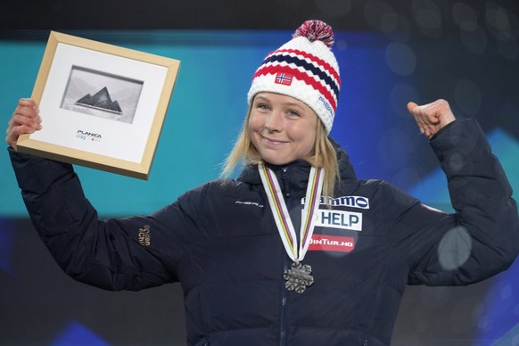 Maren Lundby of Norway poses with her silver medal for the Women HS138 Ski Jumping event at the Nordic World Championships in Planica, Slovenia, Wednesday, March 1, 2023. (AP Photo/Darko Bandic)