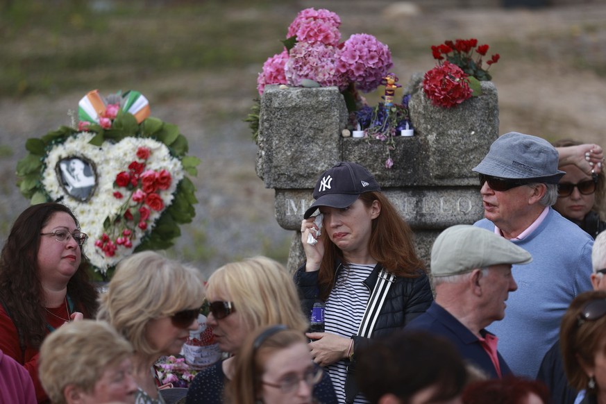 Fans gather outside the former home of Sinead O&#039;Connor ahead of the late singer&#039;s funeral, in Bray, Co Wicklow, Ireland, Tuesday, Aug. 8, 2023. O?Connor?s family has invited the public to li ...