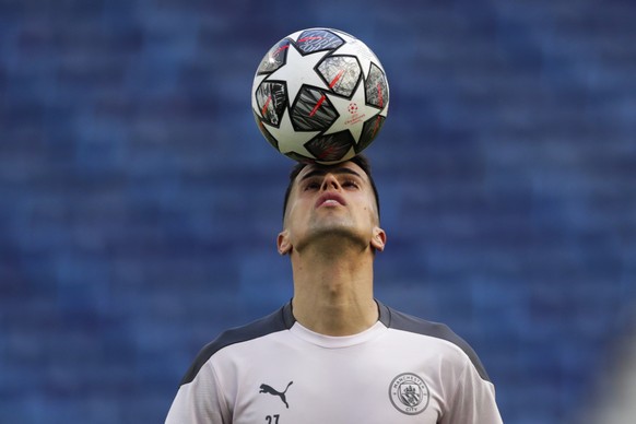 Manchester City's Joao Cancelo heads the ball during a training session ahead of the Champions League final match at the Dragao stadium in Porto, Portugal, Friday, May 28, 2021. Manchester City a ...