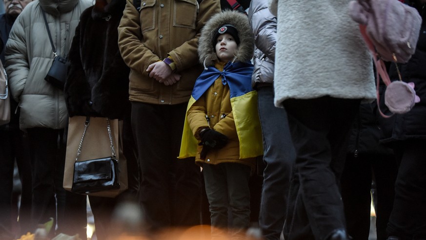 epaselect epa10526967 People attend a commemorative rally to mark the first anniversary of the bombing of the Mariupol Drama Theatre, in front of the National Opera of Ukraine in Kyiv (Kiev), Ukraine, ...