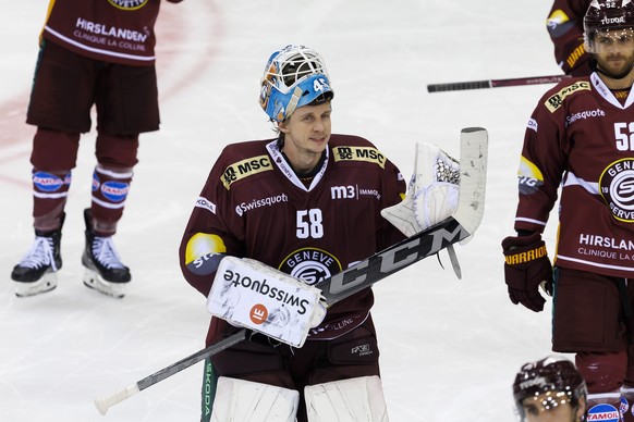 Geneve-Servette&#039;s goaltender Jussi Olkinuora celebrates the victory after defeating the team Bern at the shoutout session of National League regular season game of the Swiss Championship between  ...