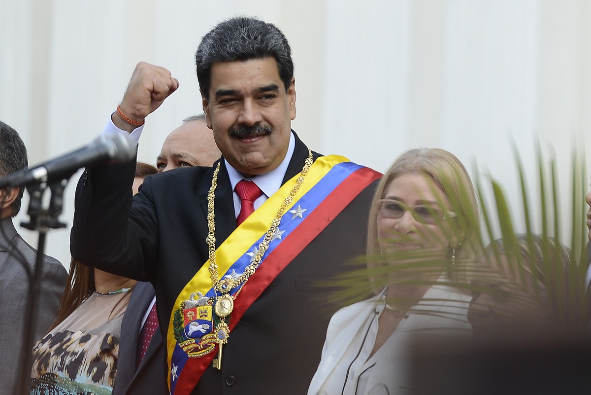 Venezuela's President Nicolas Maduro, waves as he arrives at the National Constituent Assembly's building during the celebration rally of the 20th anniversary of the Venezuelan Constitution  ...
